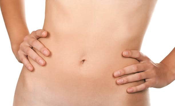 Slim female stomach isolated on white background