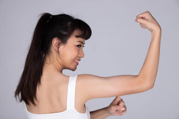 Woman after arm lift
