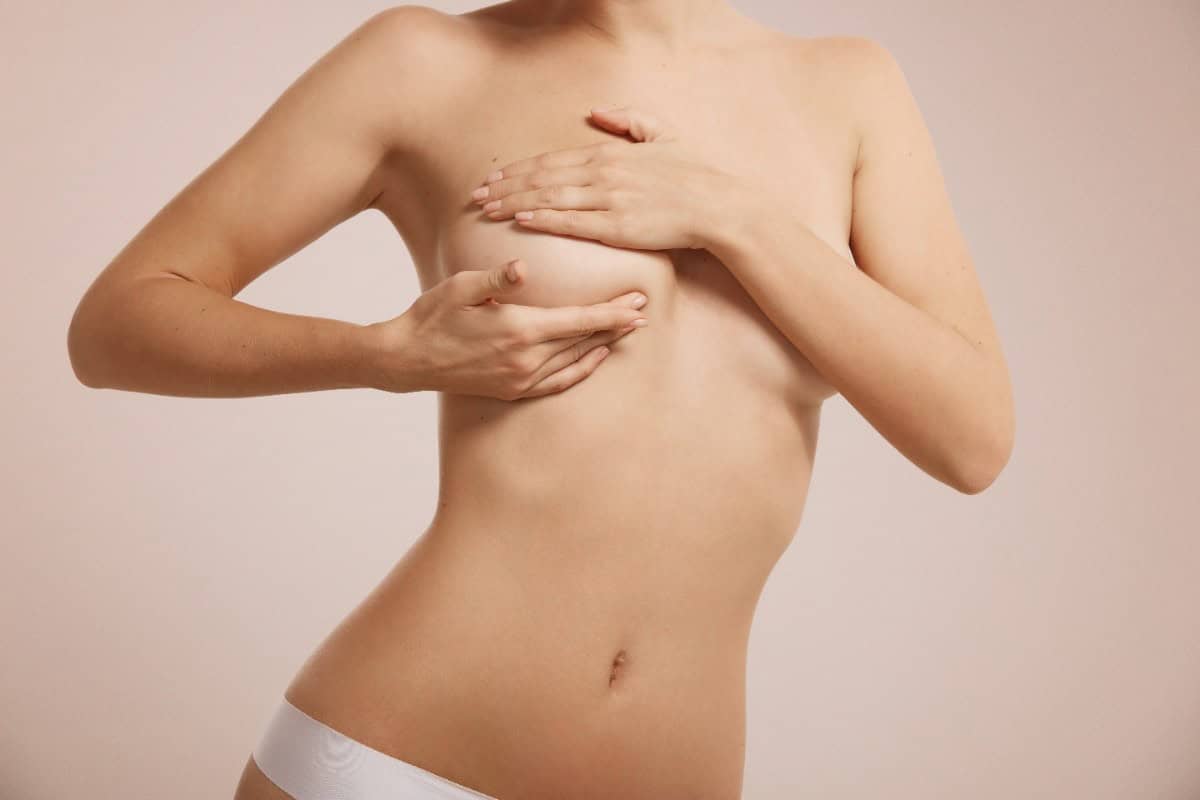 Woman after nipple reduction showing her body