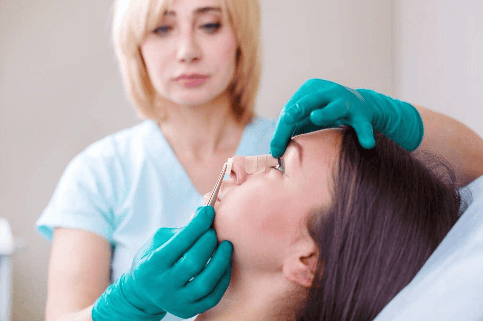 Woman receiving a cosmetic consultation for plastic surgery in Albania.